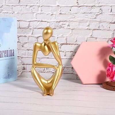 Golden sculpture thinker statue