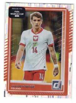 Panini Donruss Road to FIFA World Cup card featuring Polish footballer Jakub Kiwior, distinguished by its red border