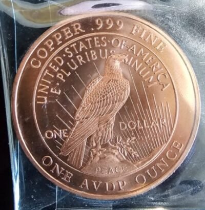 1 oz .999 fine pure copper bullion round featuring a Peace Dollar design with an eagle on the reverse.